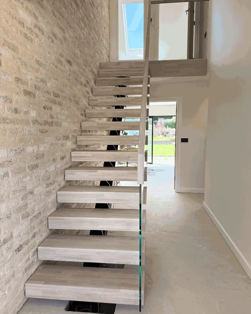Straight central spine staircase design.webp