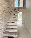 Straight central spine staircase design.webp